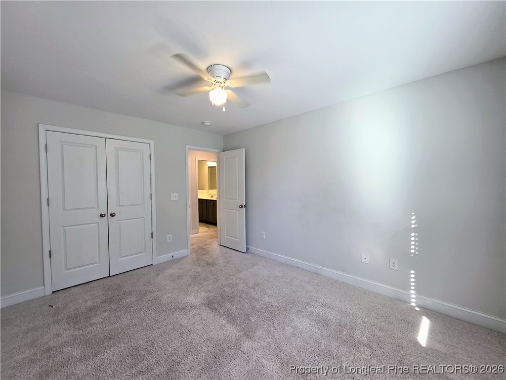 7850 Rufus Johnson Road Fayetteville, NC 28306 - Photo 10 of 25 a view of an empty room and a ceiling fan
