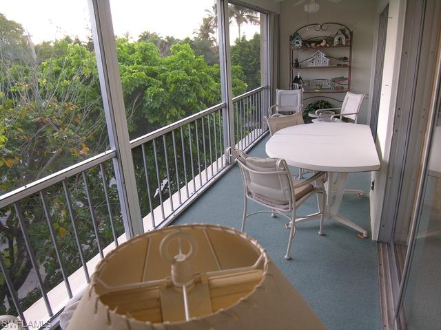 1051 3rd Street South, Unit 301 Naples, FL 34102 - Photo 14 of 15 a view of a balcony with chair