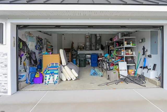 a utility room with dryer and bicycles