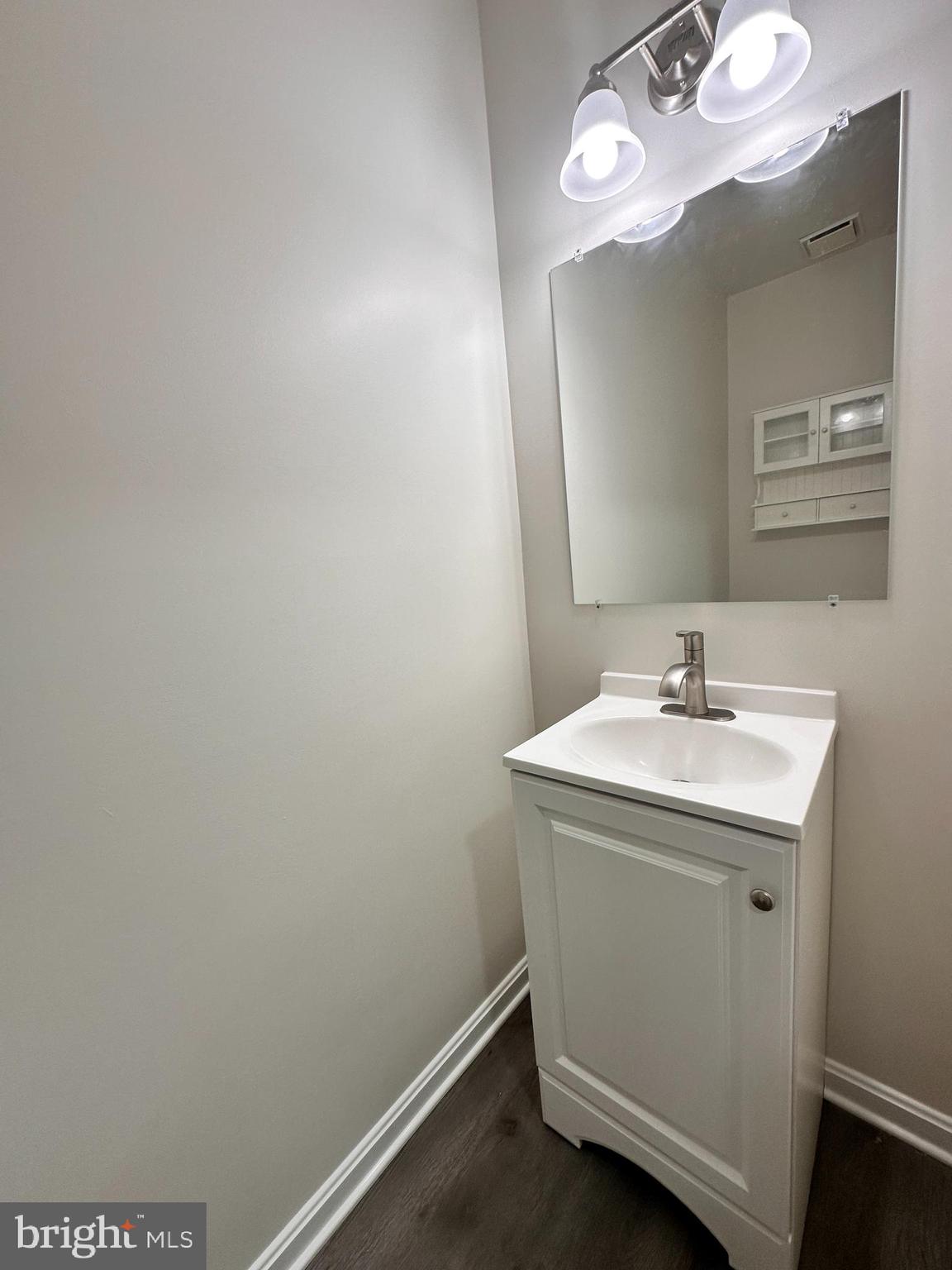 31 Amarillo Court, Unit 113 Germantown, MD 20874 - Photo 12 of 24 a bathroom with a sink and a mirror