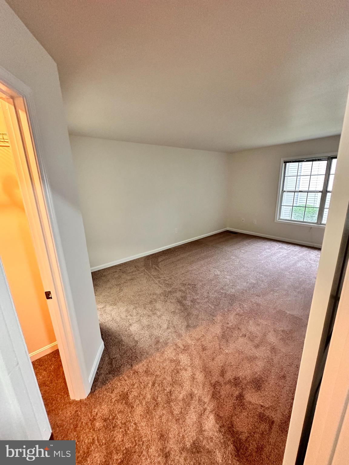 31 Amarillo Court, Unit 113 Germantown, MD 20874 - Photo 19 of 24 an empty room with windows