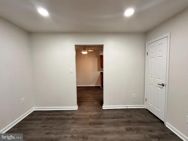 a kitchen with stainless steel appliances granite countertop wooden cabinets a refrigerator and a sink