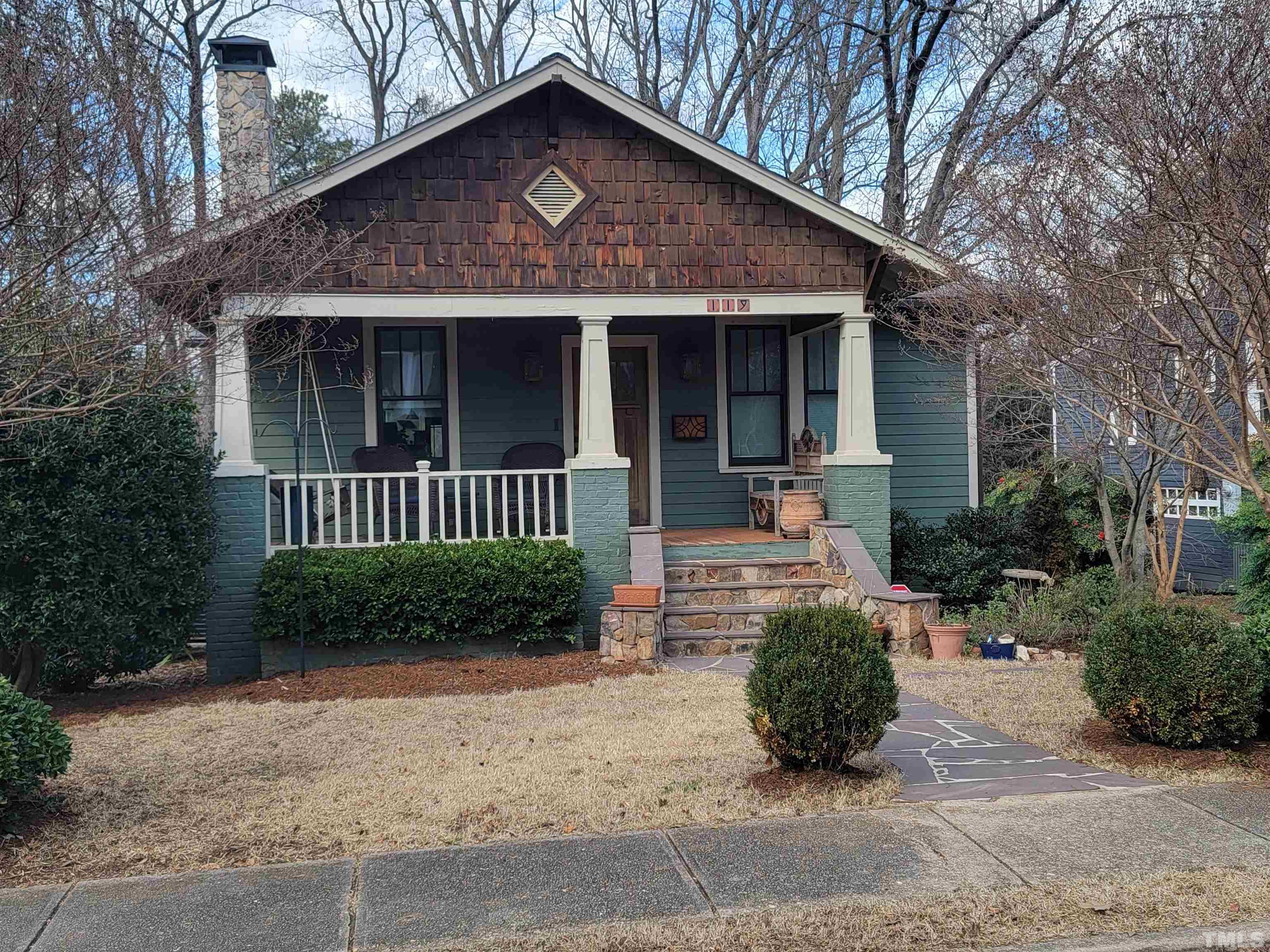 119 Hudson Street Raleigh, NC 27608 - Photo 3 of 58 a front view of a house with a yard