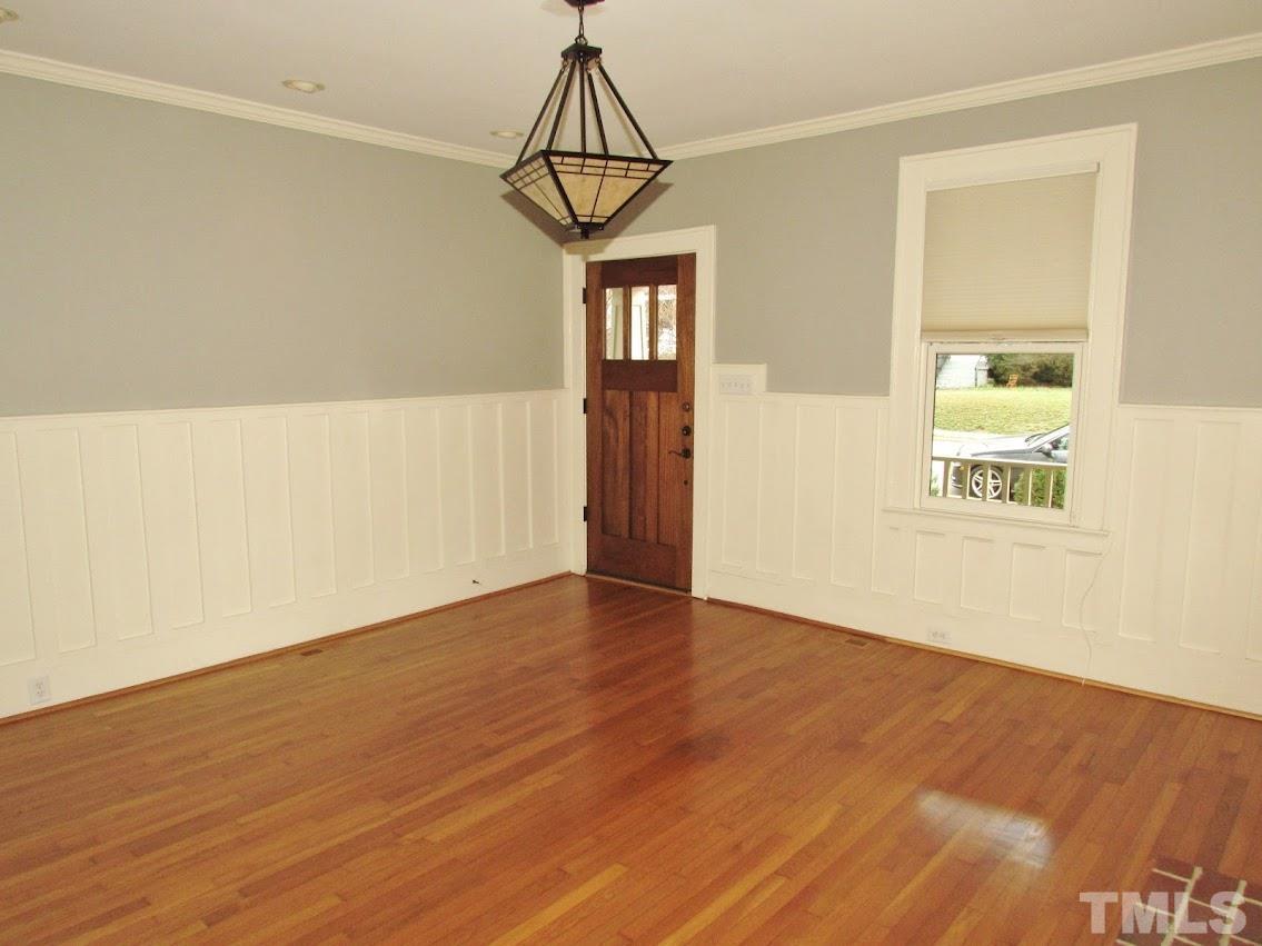 119 Hudson Street Raleigh, NC 27608 - Photo 58 of 58 a view of an empty room with wooden floor and a window