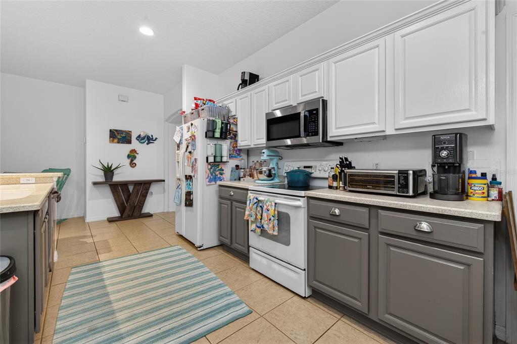 339 Mariners Gate Drive Edgewater, FL 32141 - Photo 11 of 41 a kitchen with cabinets a sink and appliances