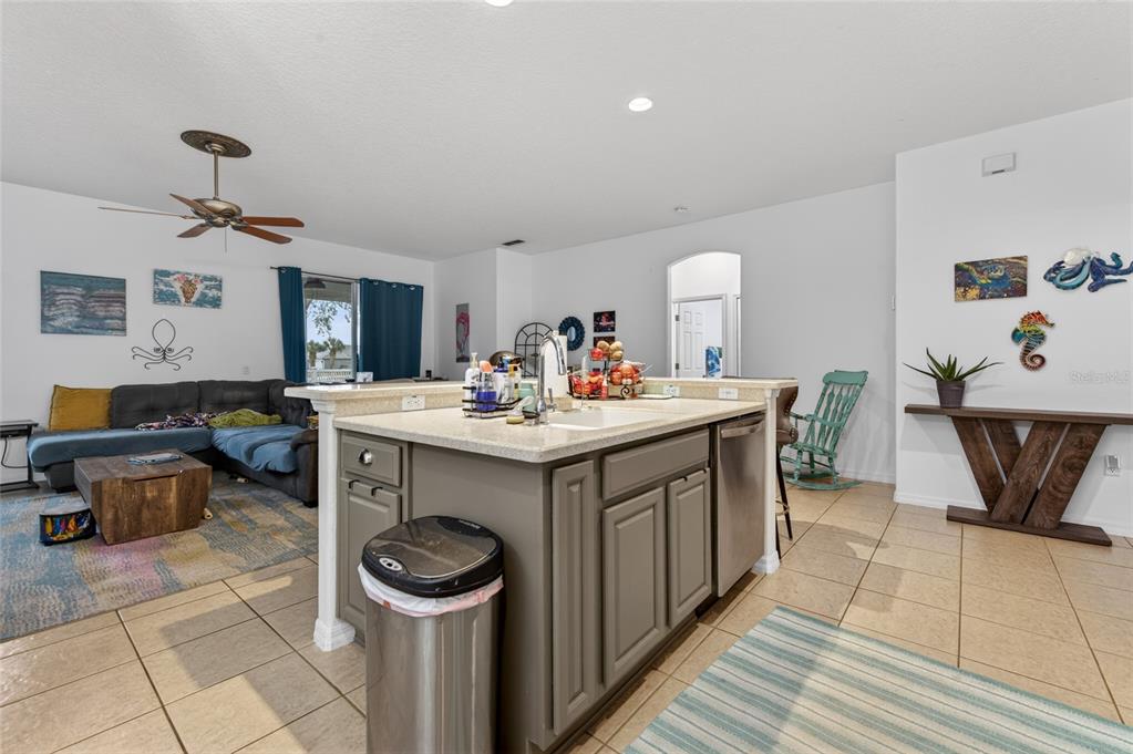 339 Mariners Gate Drive Edgewater, FL 32141 - Photo 12 of 41 a kitchen with a sink stove and cabinets