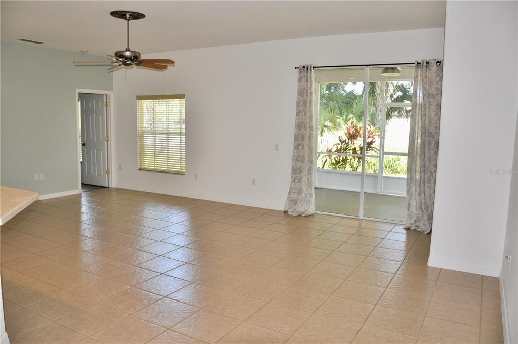339 Mariners Gate Drive Edgewater, FL 32141 - Photo 18 of 41 a view of an entryway with a floor to ceiling window and wooden floor
