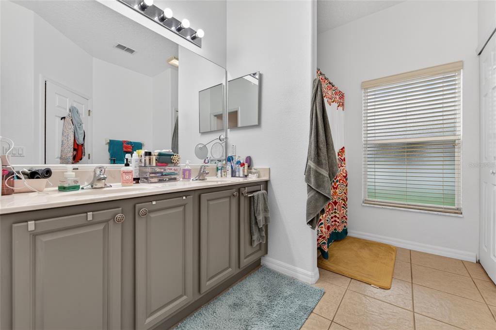 339 Mariners Gate Drive Edgewater, FL 32141 - Photo 19 of 41 a bathroom with a sink and a mirror