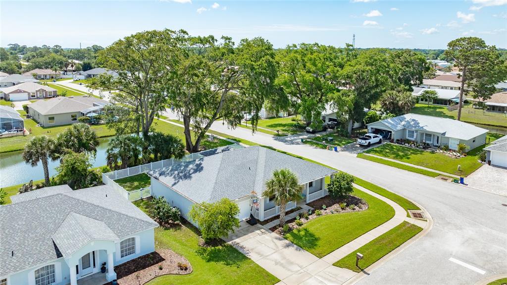 339 Mariners Gate Drive Edgewater, FL 32141 - Photo 27 of 41 an aerial view of a house with a garden and swimming pool