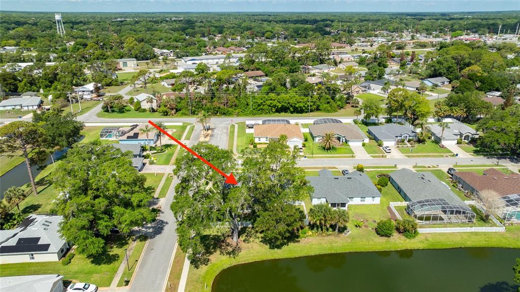 339 Mariners Gate Drive Edgewater, FL 32141 - Photo 31 of 41 an aerial view of residential houses with outdoor space and trees all around