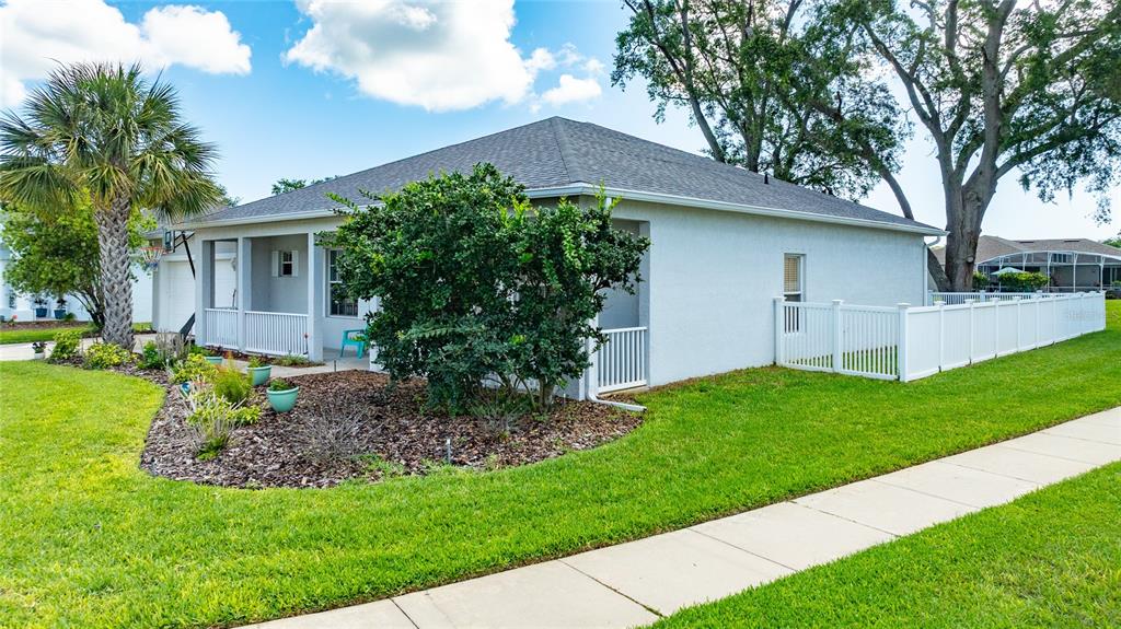 339 Mariners Gate Drive Edgewater, FL 32141 - Photo 39 of 41 a front view of house with a garden