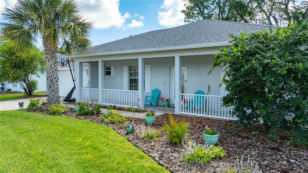 339 Mariners Gate Drive Edgewater, FL 32141 - Photo 40 of 41 a front view of a house with garden