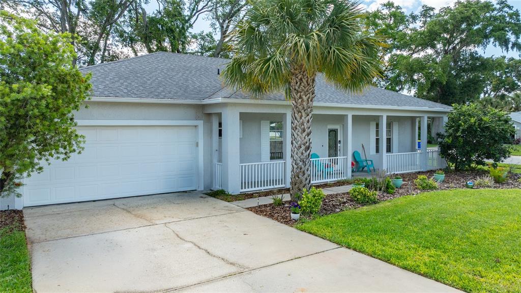 339 Mariners Gate Drive Edgewater, FL 32141 - Photo 41 of 41 a front view of house with yard and green space
