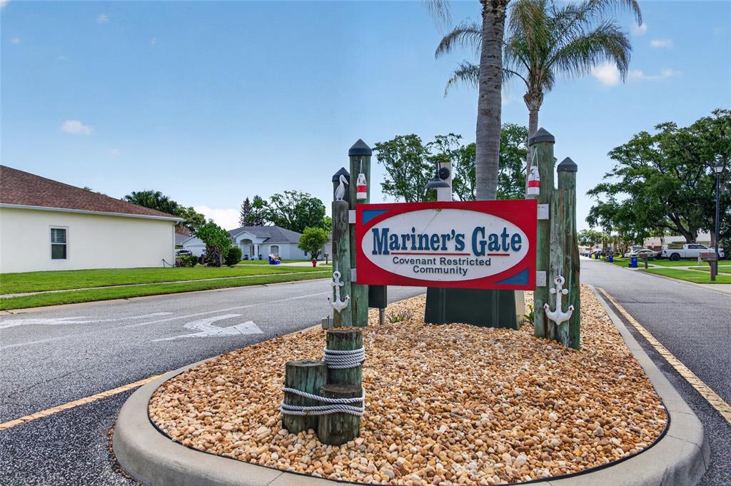 339 Mariners Gate Drive Edgewater, FL 32141 - Photo 6 of 41 a sign on the side of the building