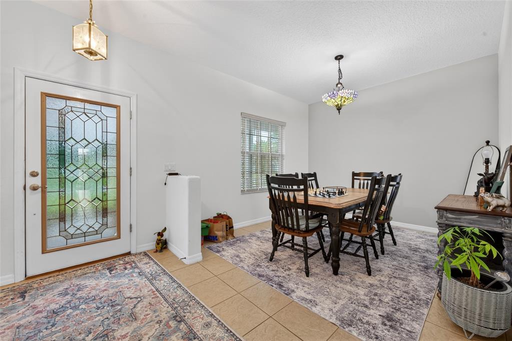 339 Mariners Gate Drive Edgewater, FL 32141 - Photo 8 of 41 a view of a dining room with furniture window and outside view