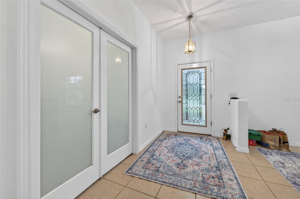 339 Mariners Gate Drive Edgewater, FL 32141 - Photo 9 of 41 a front view of a house with a hallway