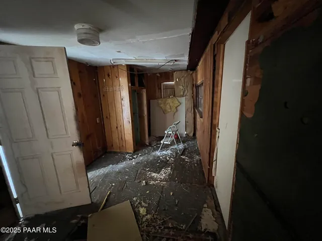 a big room with closet and wooden floors