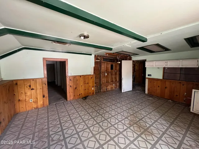 a view of an empty room with a fireplace