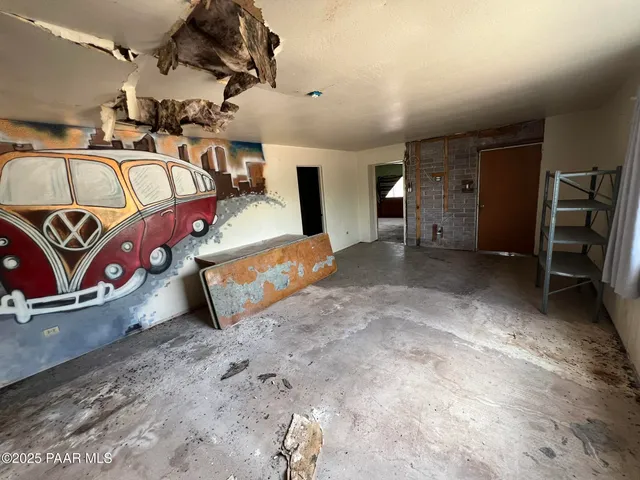 a bed room with a bed and a window