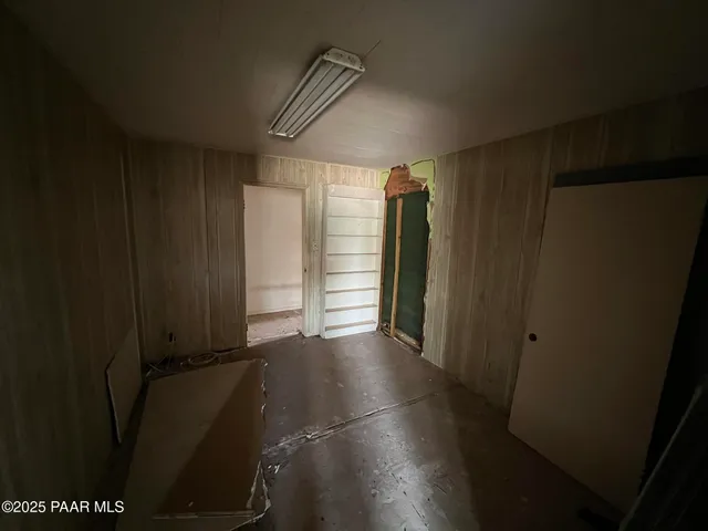 a view of an empty room and a window