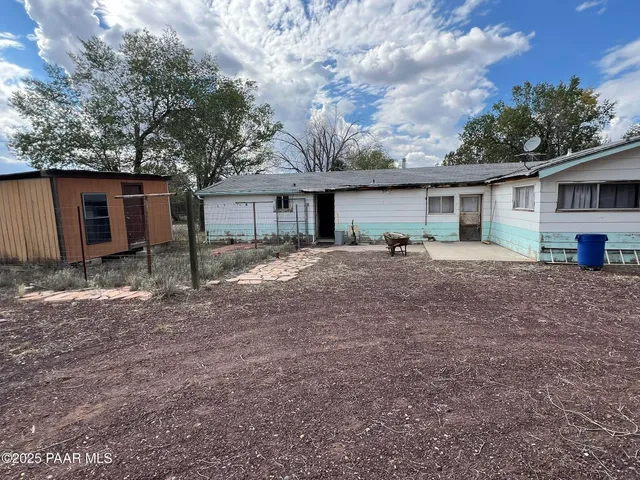 a house view with a backyard space
