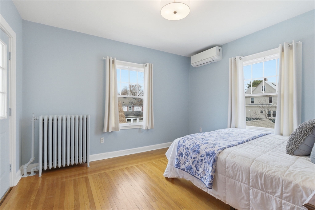 79 Florence Avenue Melrose, MA 02176 - Photo 13 of 35 a bedroom with a bed and a window