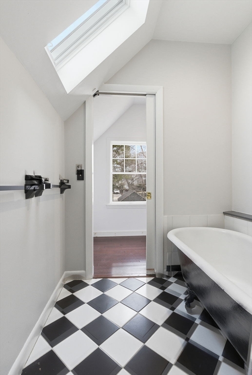 79 Florence Avenue Melrose, MA 02176 - Photo 17 of 35 a room with a black white checkered floor with a black white checkered floor