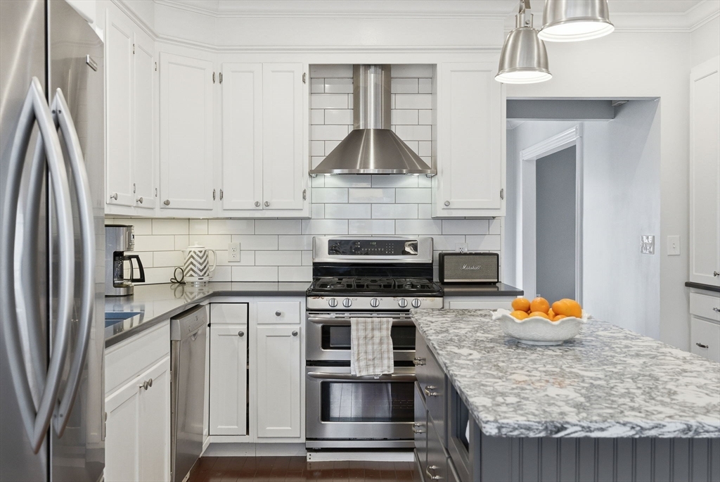 79 Florence Avenue Melrose, MA 02176 - Photo 2 of 35 a kitchen with stainless steel appliances granite countertop a stove and a sink