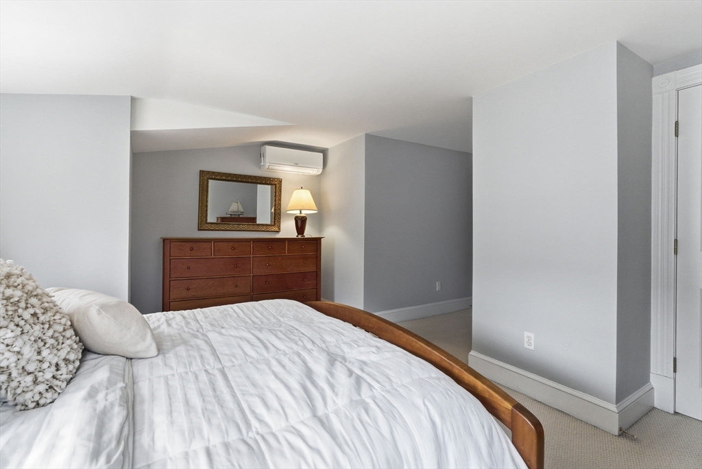 79 Florence Avenue Melrose, MA 02176 - Photo 21 of 35 a bedroom with a bed and a dresser