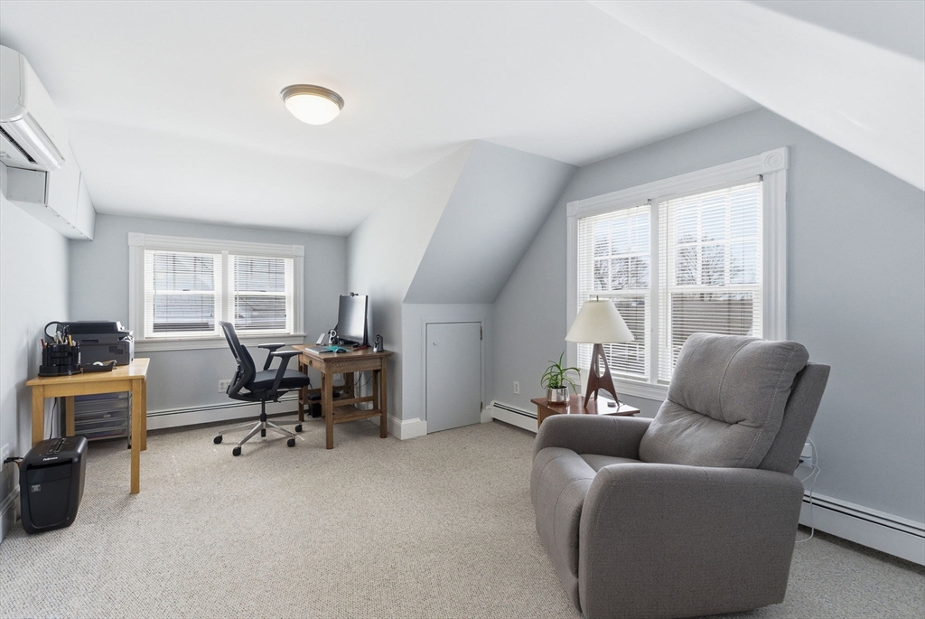 79 Florence Avenue Melrose, MA 02176 - Photo 23 of 35 a living room with furniture and a window