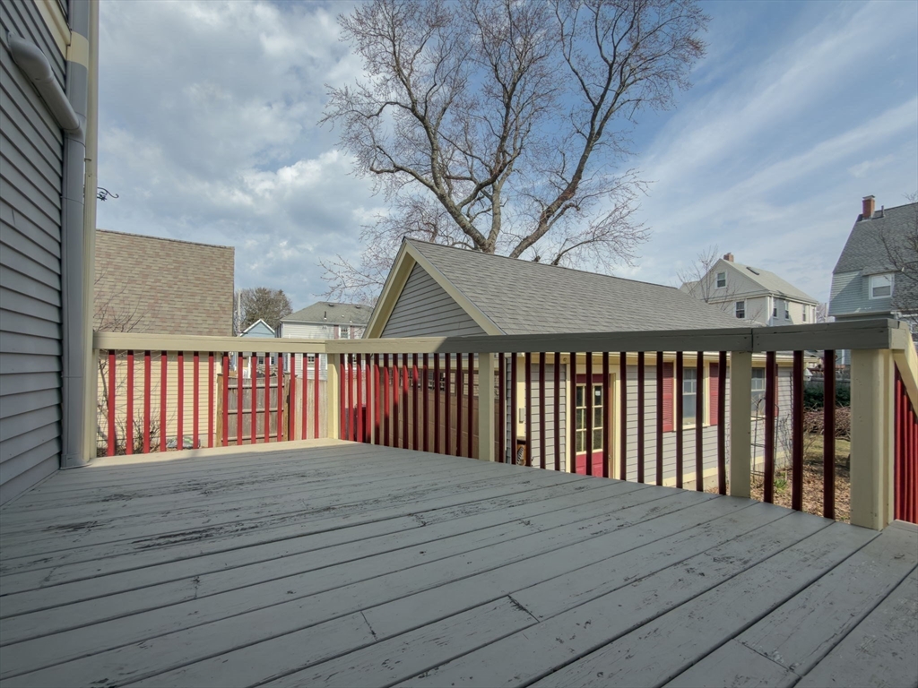 79 Florence Avenue Melrose, MA 02176 - Photo 25 of 35 a balcony with wooden floor