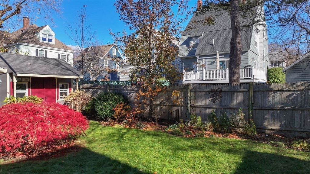 79 Florence Avenue Melrose, MA 02176 - Photo 26 of 35 a front view of a house with a yard and tree