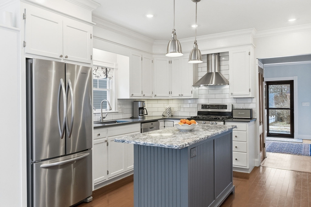 79 Florence Avenue Melrose, MA 02176 - Photo 3 of 35 a kitchen with stainless steel appliances granite countertop a sink stove and refrigerator
