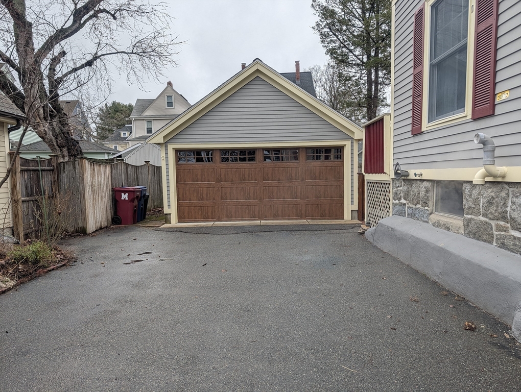 79 Florence Avenue Melrose, MA 02176 - Photo 31 of 35 a view of a house with a yard and garage