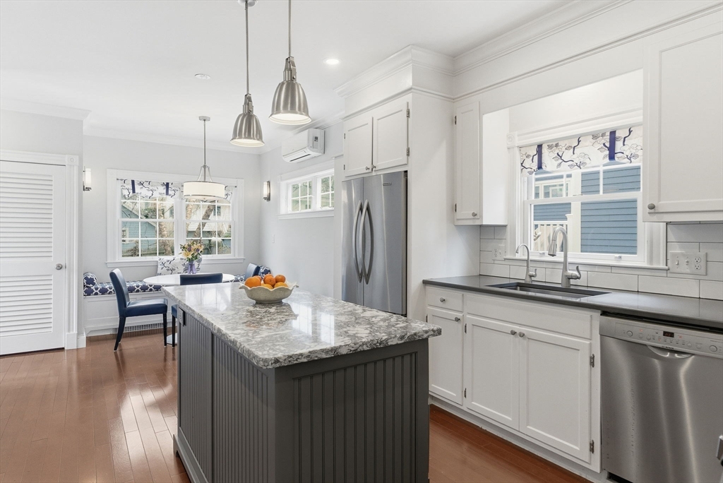 79 Florence Avenue Melrose, MA 02176 - Photo 5 of 35 a kitchen with stainless steel appliances granite countertop a sink stove and refrigerator