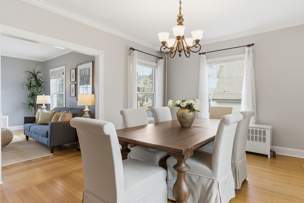 79 Florence Avenue Melrose, MA 02176 - Photo 9 of 35 a view of a dining room with furniture wooden floor and chandelier