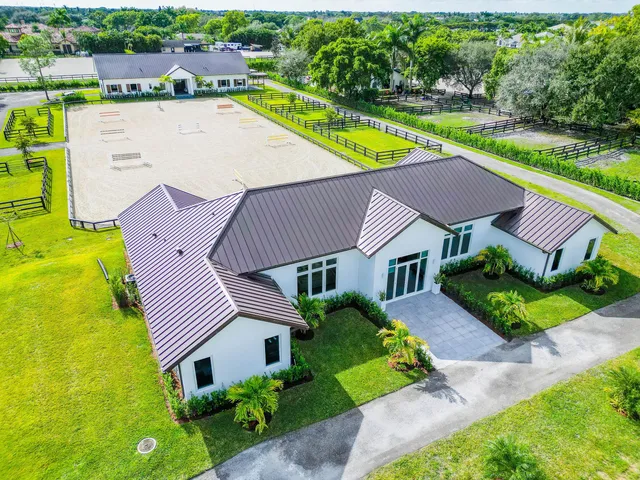 an aerial view of a house with a garden and plants
