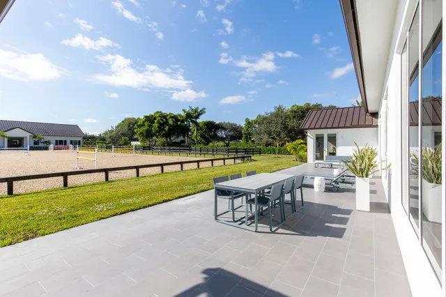 a view of swimming pool with a patio