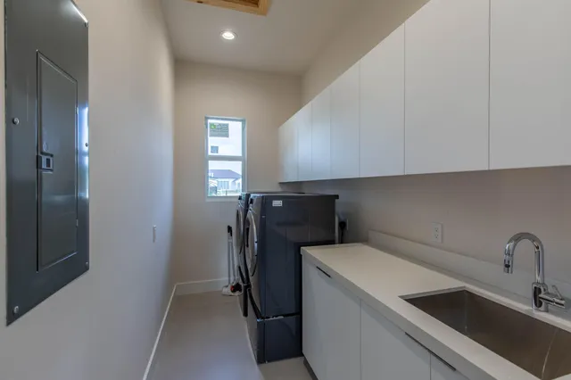 a view of storage and utility room with washer and dryer
