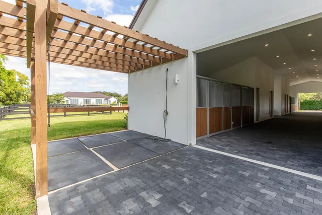a view of an empty room with a floor to ceiling window and an outdoor view