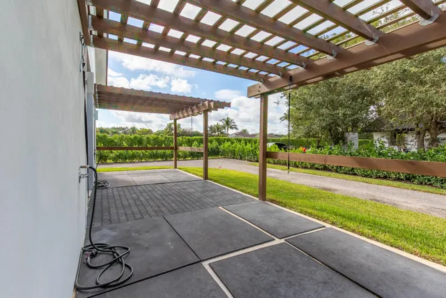 a view of a swimming pool with an outdoor seating area
