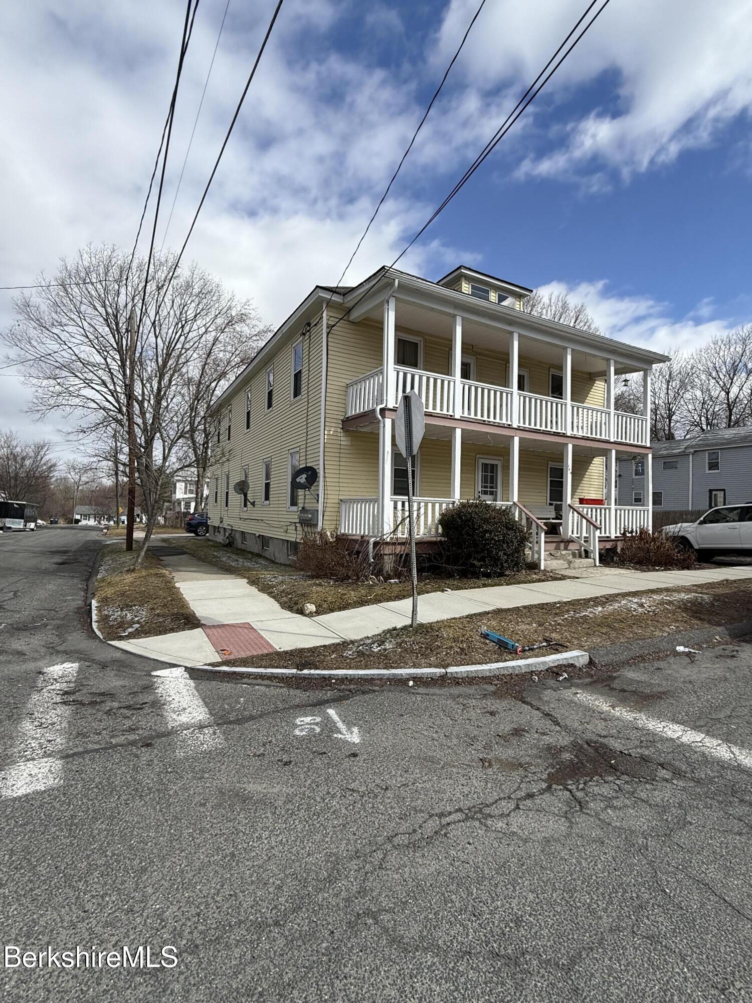 144 Madison Avenue, Unit 4 Pittsfield, MA 01201 - Photo 3 of 5 a view of a house with a yard