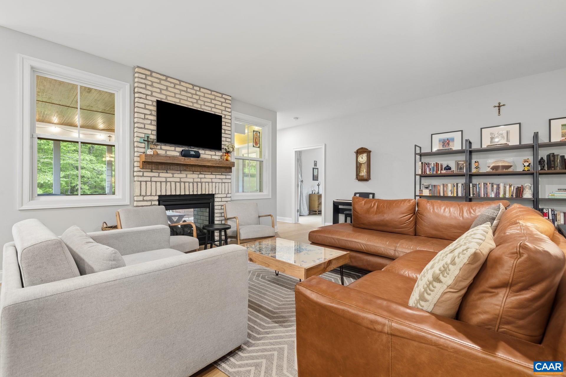 271 Two Rivers Drive Troy, VA 22974 - Photo 13 of 63 a living room with furniture fireplace and flat screen tv