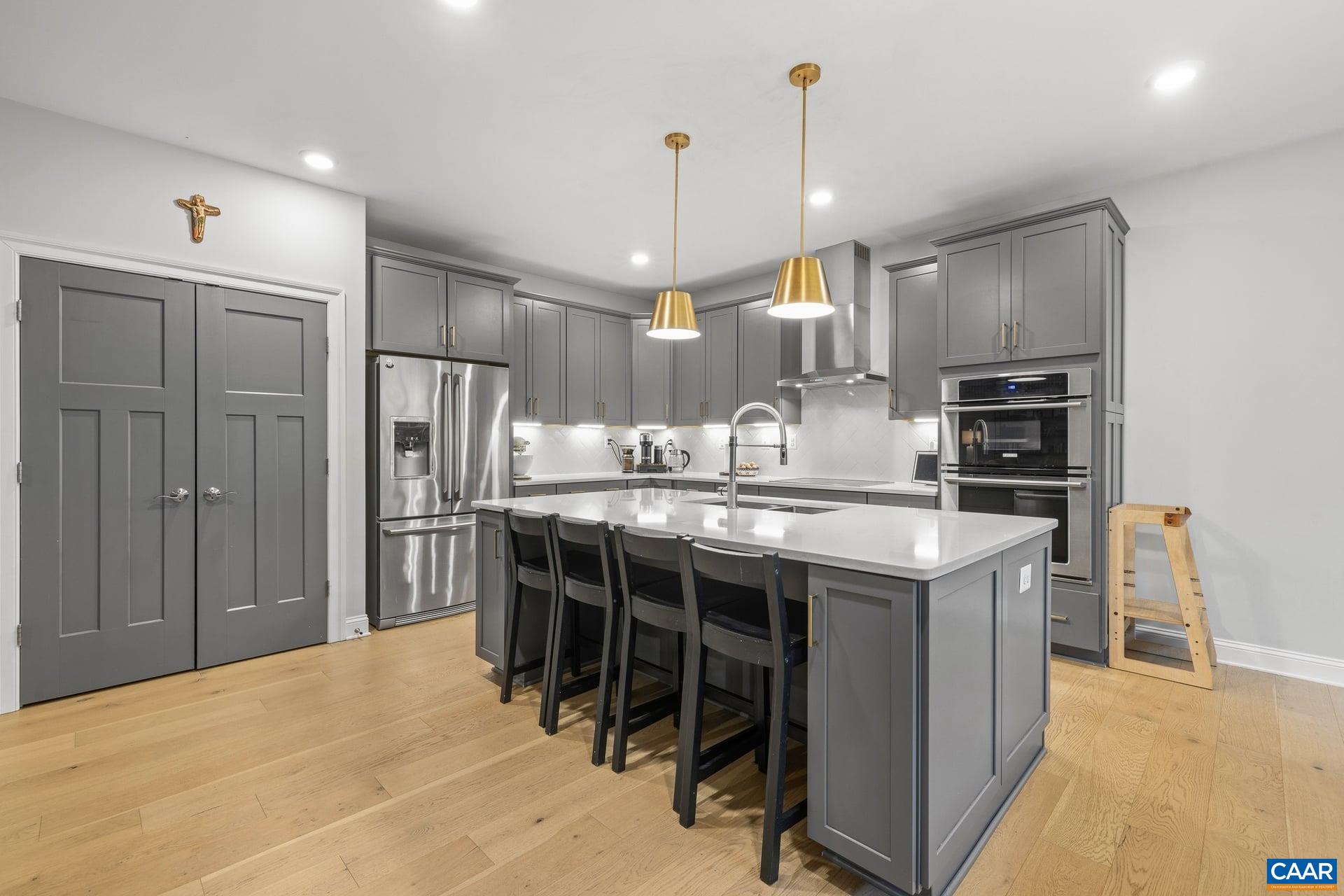 271 Two Rivers Drive Troy, VA 22974 - Photo 16 of 63 a kitchen with kitchen island a sink stove and refrigerator