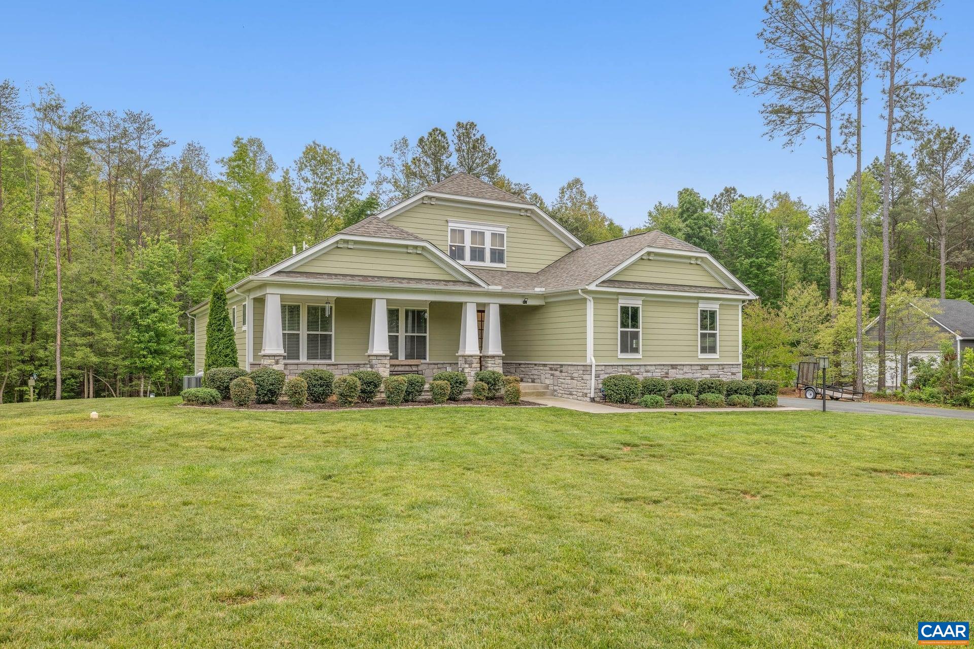 271 Two Rivers Drive Troy, VA 22974 - Photo 2 of 63 a front view of a house with a garden