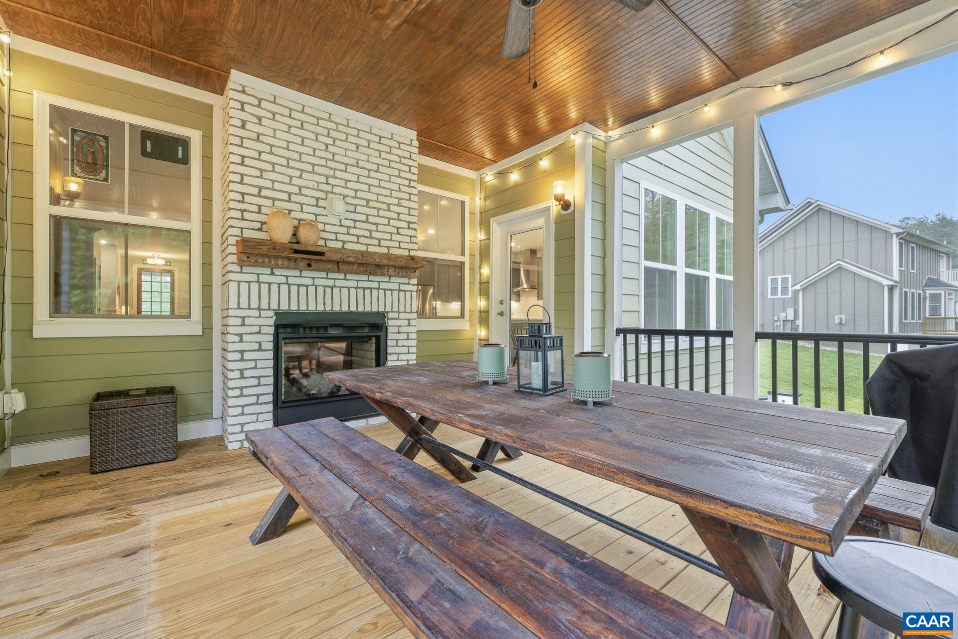 271 Two Rivers Drive Troy, VA 22974 - Photo 23 of 63 a view of a deck with wooden floor and a fireplace