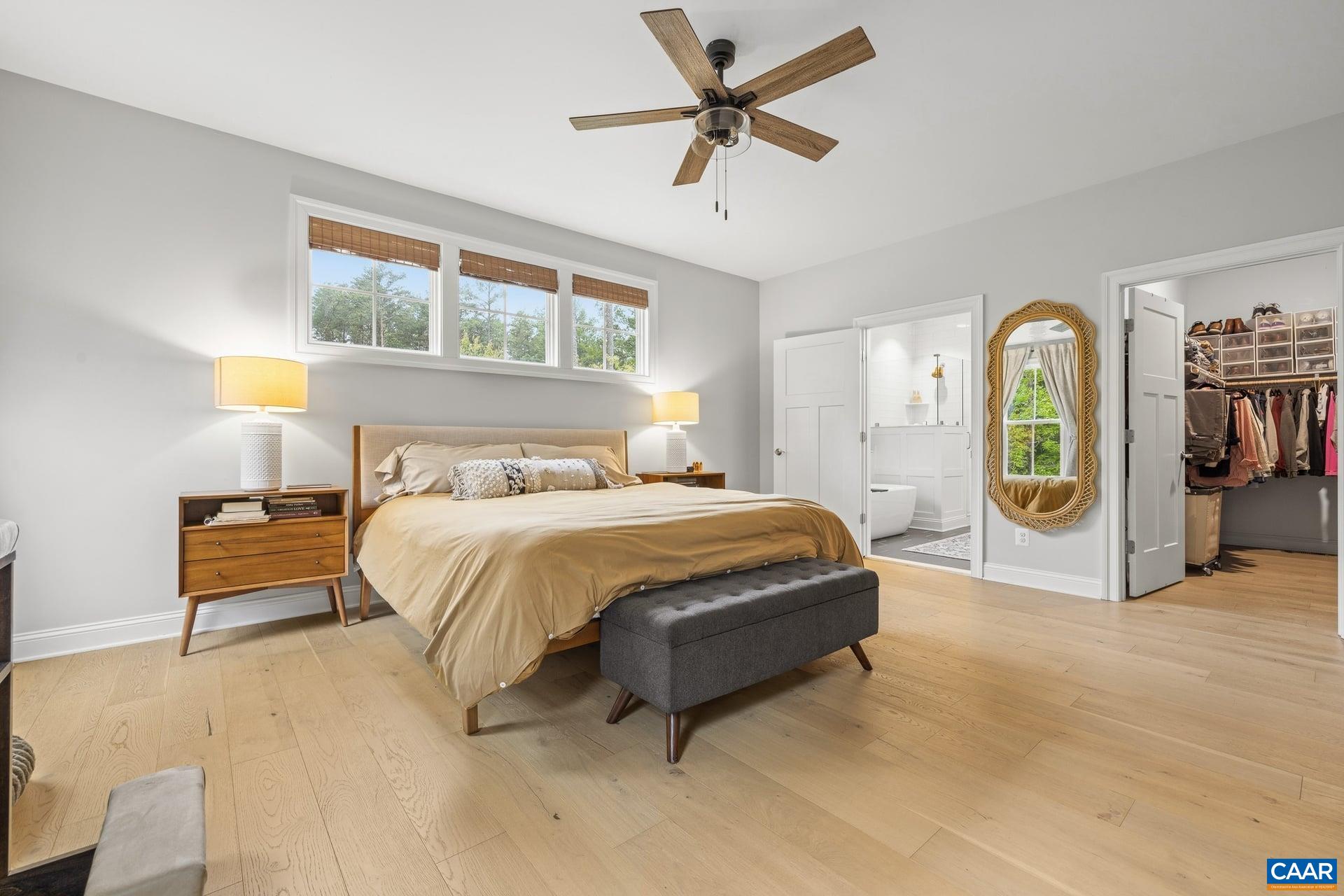 271 Two Rivers Drive Troy, VA 22974 - Photo 29 of 63 a spacious bedroom with a bed a window and closet