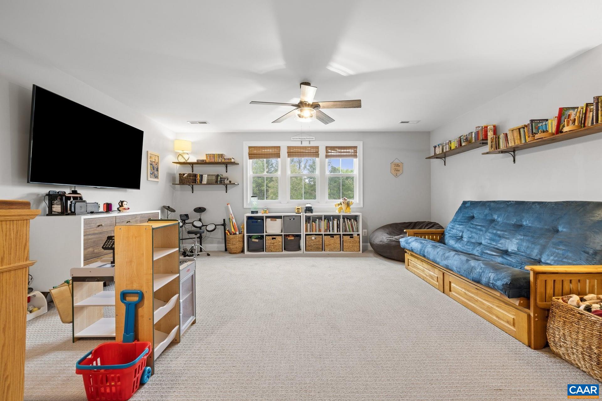271 Two Rivers Drive Troy, VA 22974 - Photo 38 of 63 a living room with furniture and a flat screen tv
