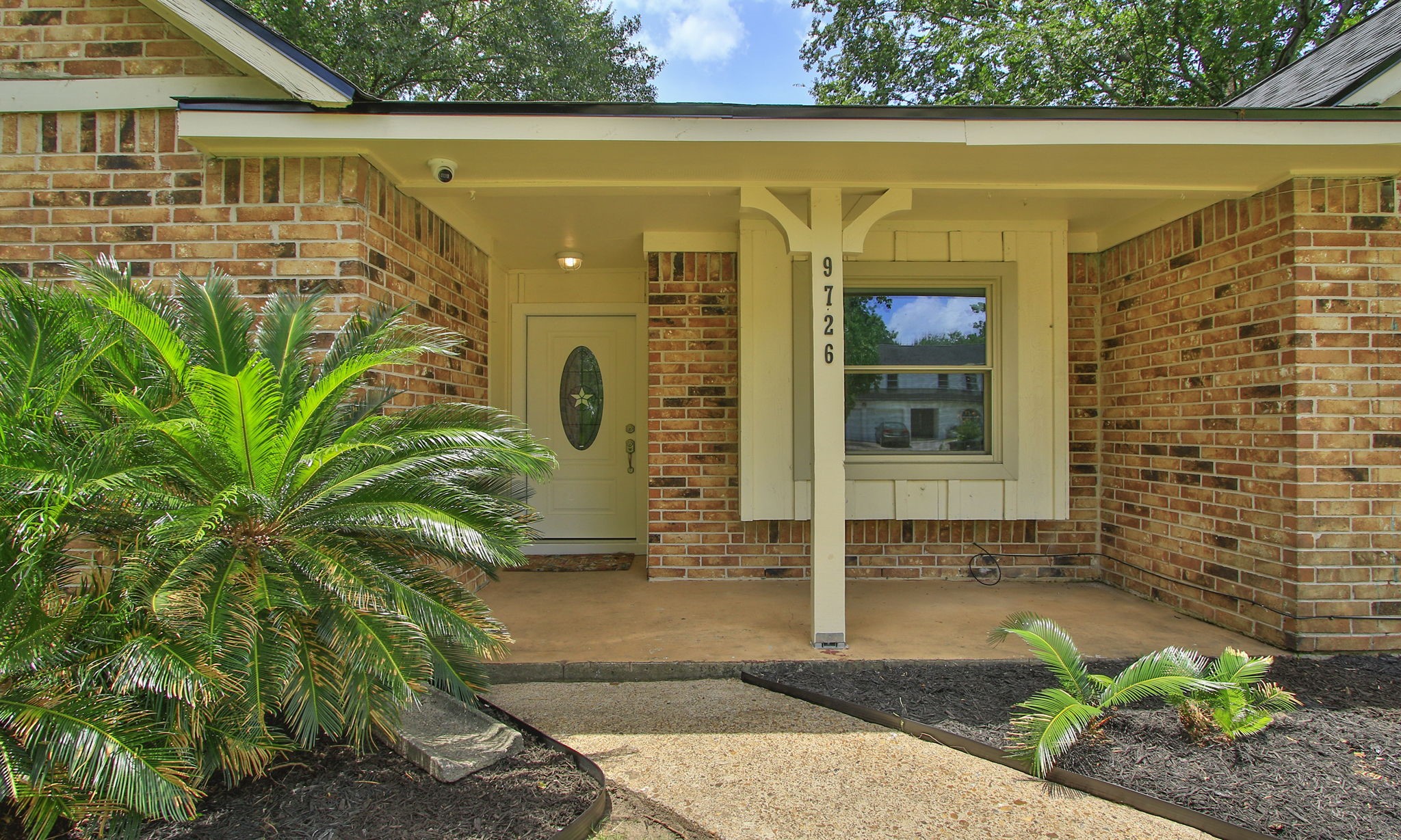 9726 John Bank Drive Spring, TX 77379 - Photo 2 of 36 It has a large welcoming front porch.