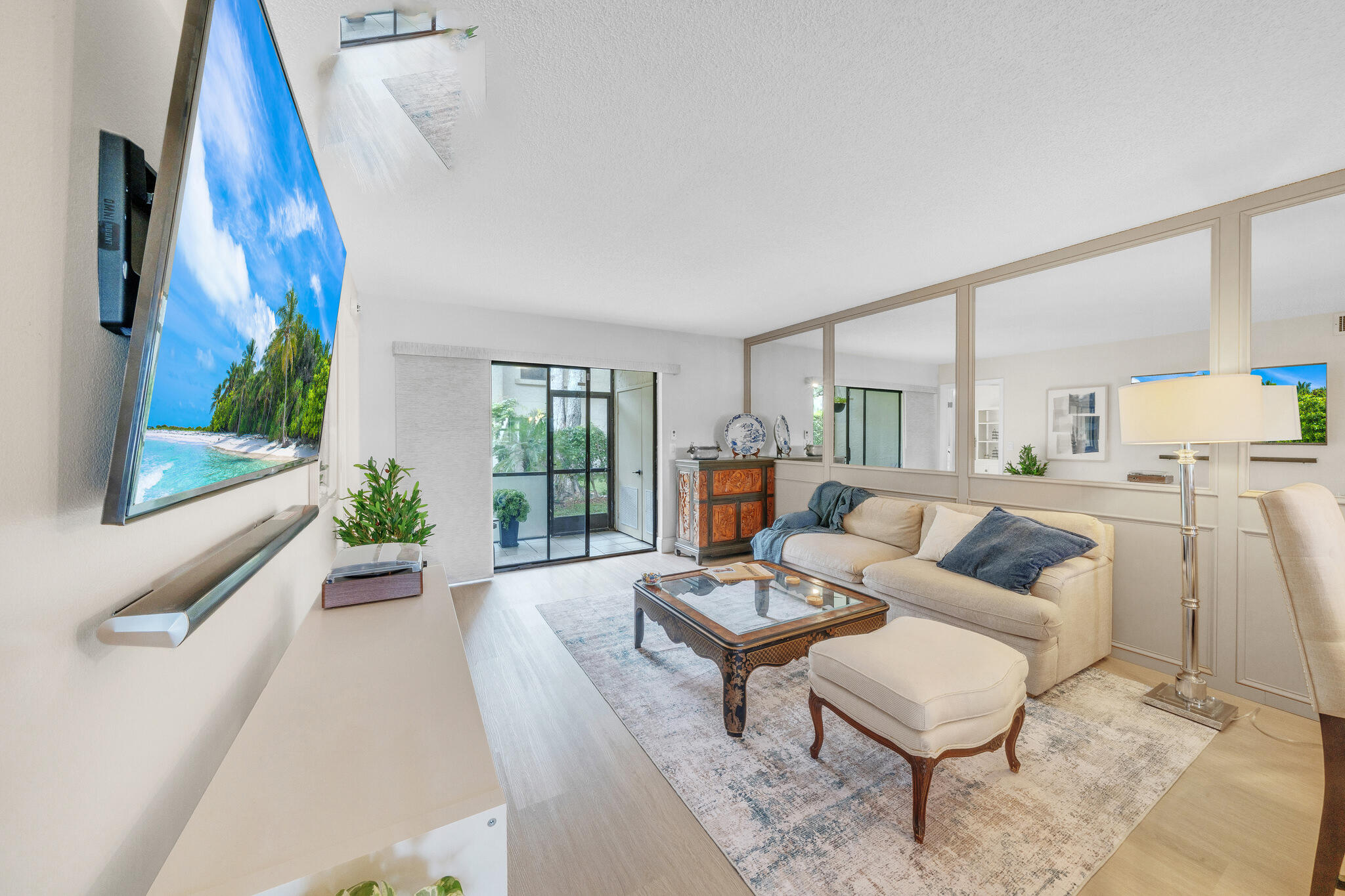 22136 Palms Way, Unit 103 Boca Raton, FL 33433 - Photo 9 of 42 a living room with furniture and a large window